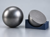 Conceptual CGI: Complete steel sphere beside a uniform solid steel hemispherical section; through-section material concept