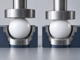 Conceptual CGI: White PTFE sphere resting on a broad seat beside the same sphere geometry with a very subtle larger contact patch under a neutral top platen; qualitative creep and contact illustration, no dimensions