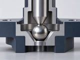 Conceptual CGI: vacuum-instrument mechanical locator cutaway with a niobium sphere against a clean conical contact, no medical or accelerator claims