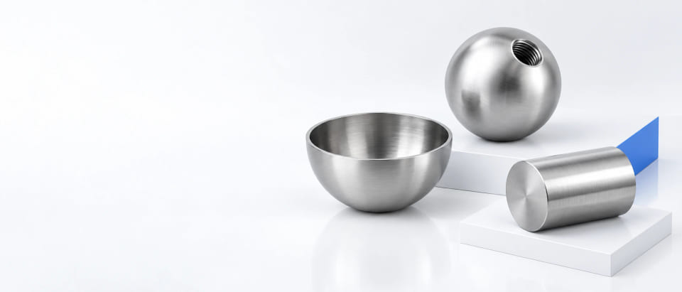 CGI concept of a hollow metal hemisphere, threaded solid ball and cylindrical roller in a white studio