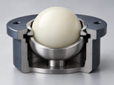 Conceptual CGI: Cutaway compact low-load ball transfer socket: one ivory nylon sphere supported in a restrained stainless cup, ring contact clearly visible, no labels, no section through ball